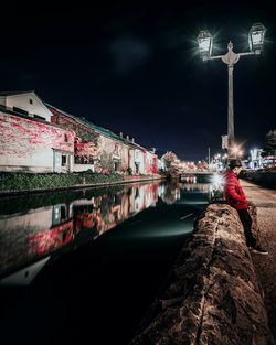 Illuminated street lights in city at night