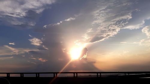 Silhouette bridge against sky during sunset