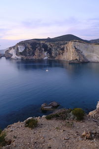 Scenic view of sea and rocks against sky