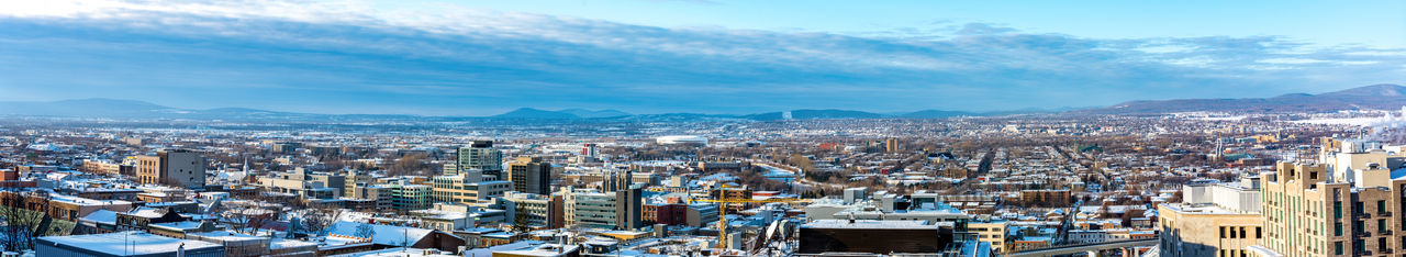 High angle view of city against cloudy sky