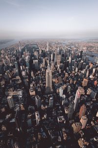 High angle view of illuminated cityscape against sky