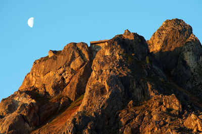 Scenic view of mountains against blue sky