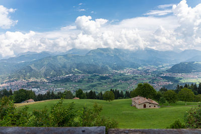 Scenic view of landscape and mountains against sky