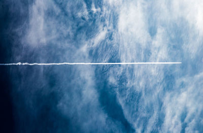 Aerial view of vapor trail in sky