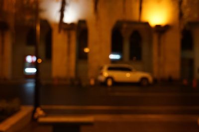 Defocused image of illuminated city at night