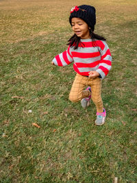 Full length of woman standing on field