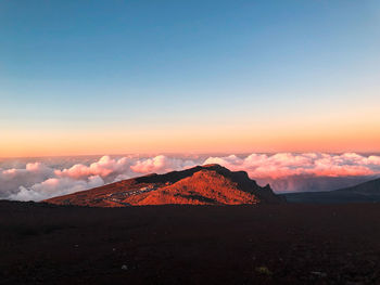 Scenic view of mountains against sky during sunset