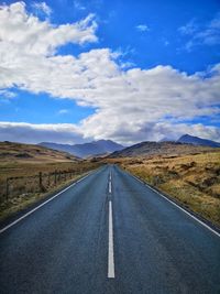 Empty road against sky