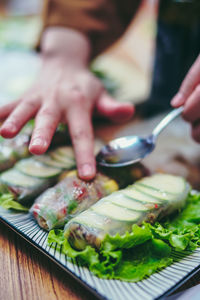 Close-up of person preparing food