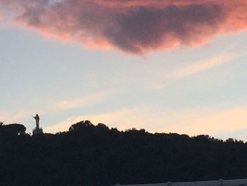 Silhouette of trees against sky during sunset