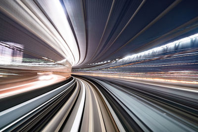 Light trails on illuminated city at night