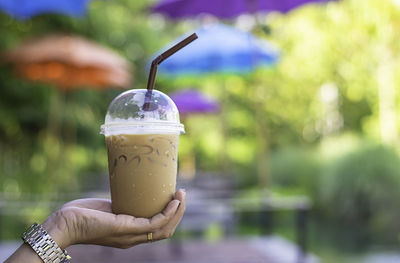 Close-up of hand holding drink