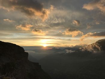 Scenic view of mountains against sky during sunset