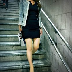 Woman standing on stairs