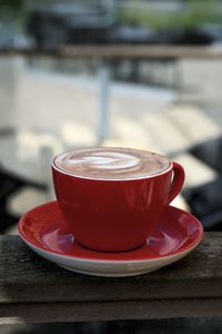 Close-up of cappuccino served on table at cafe