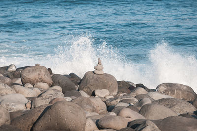 Waves splashing on rocks at shore