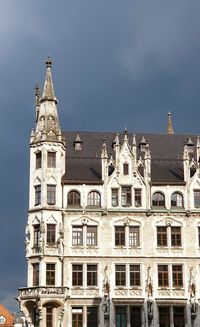 Low angle view of buildings against blue sky