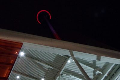 Low angle view of illuminated lights at night