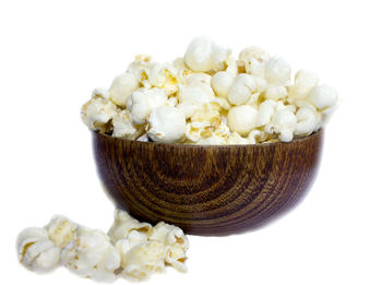 Close-up of ice cream in bowl against white background