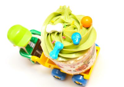 Close-up of multi colored candies against white background