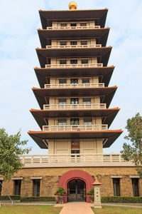 Low angle view of tall building against the sky