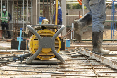 Low section of man working at construction site