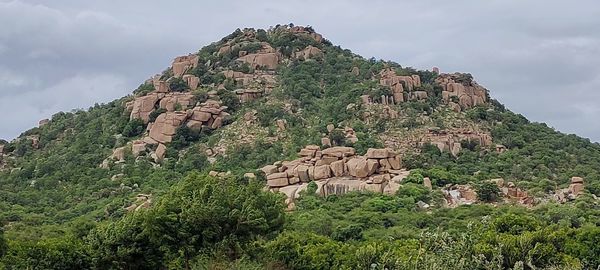 Built structure on mountain against sky