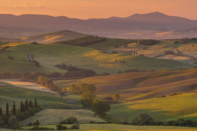 Scenic view of landscape against sky during sunset