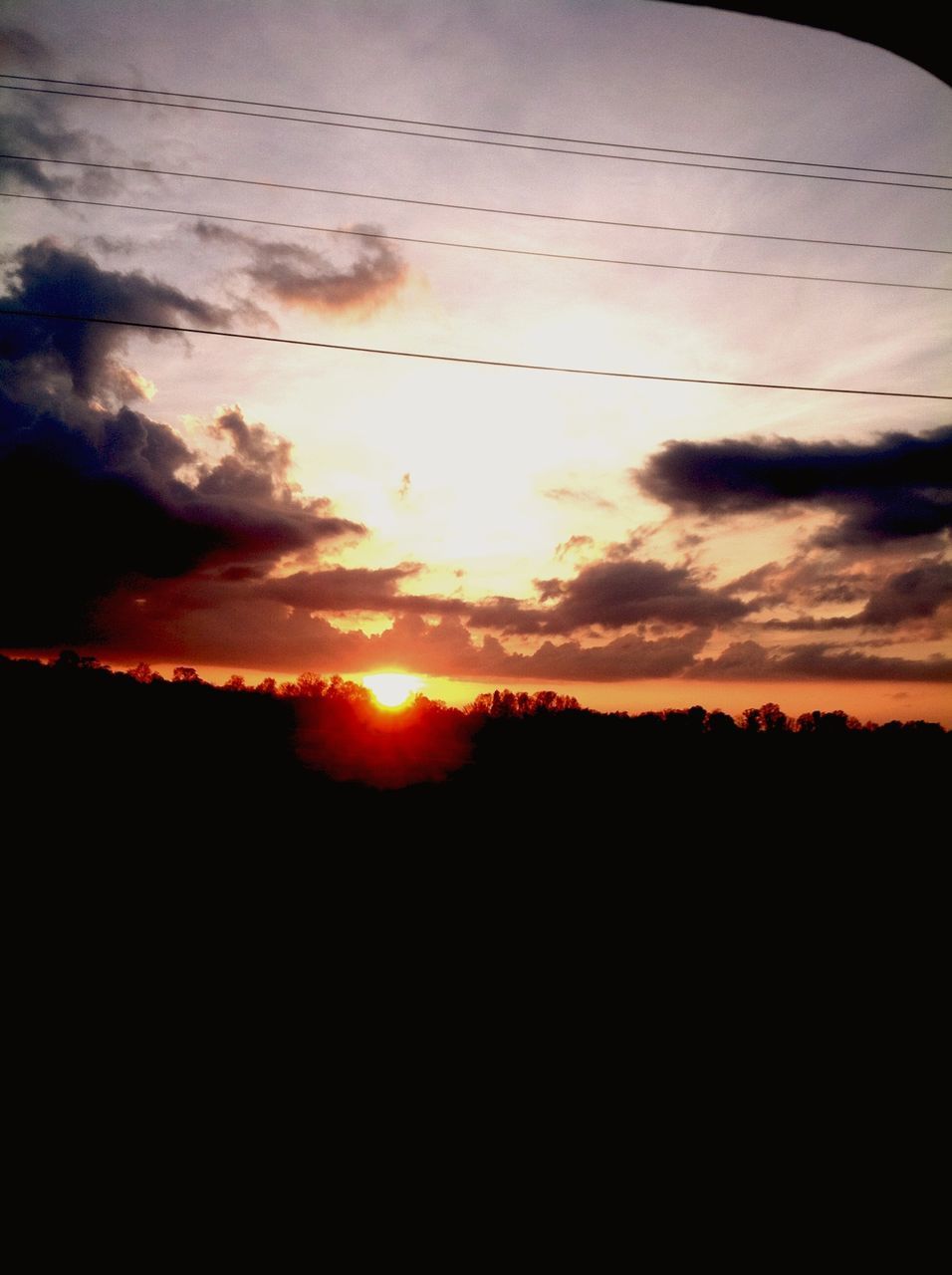 sunset, silhouette, sun, scenics, sky, beauty in nature, tranquil scene, orange color, tranquility, idyllic, nature, cloud - sky, landscape, dark, cloud, sunlight, dramatic sky, outdoors, outline, majestic