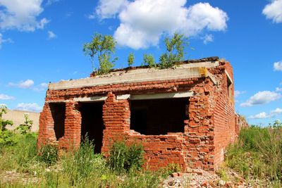 Low angle view of old ruin against sky