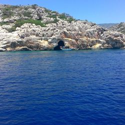 Scenic view of sea against clear blue sky