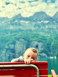 Portrait of boy looking at mountain