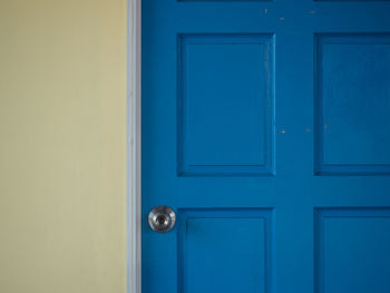 Closed blue door of building