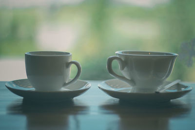 Close-up of coffee cup on table