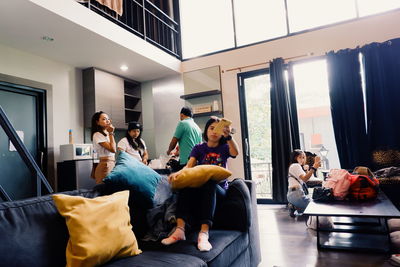 People sitting in corridor of building