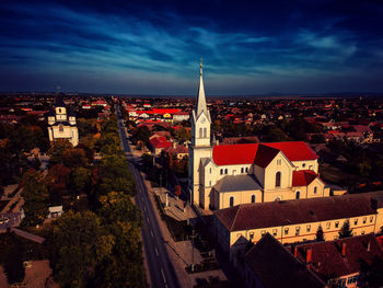 High angle view of illuminated buildings in city against sky