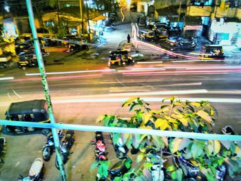 View of traffic on city street at night