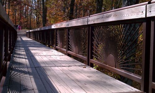 Footbridge against trees