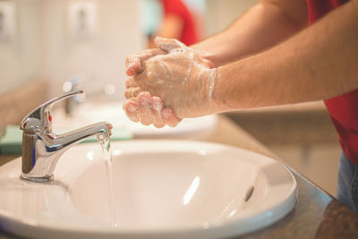 Midsection of woman in bathroom