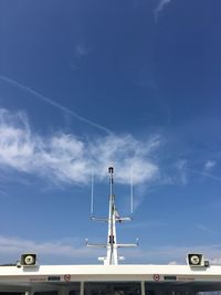 Low angle view of telephone pole against sky