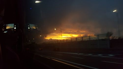 Road against sky at night