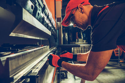 Side view of man working at airport