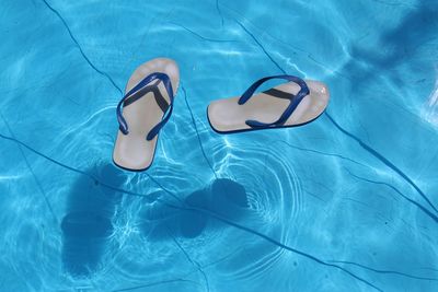 High angle view of swimming flip flops