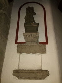 Low angle view of old statue in building