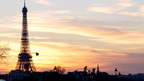 Silhouette of communications tower at sunset