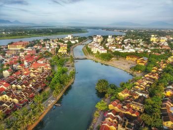 High angle view of river amidst buildings in city