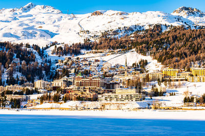 The town and lake of santk moritz in winter. engadin, switzerland.