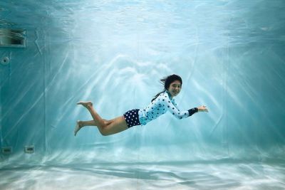 Portrait of woman swimming in pool