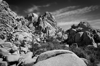 Rock formations on landscape against sky