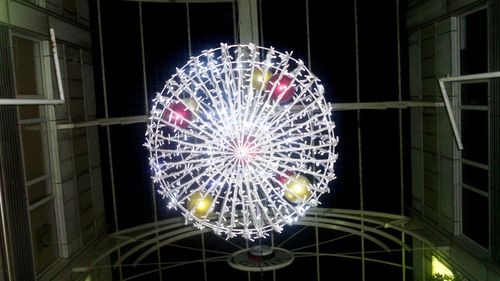 Low angle view of illuminated ferris wheel